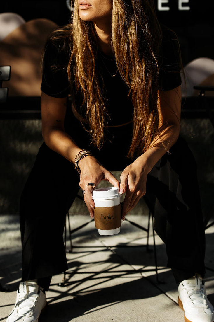 A warm welcome at Hola, coffee cups in hand