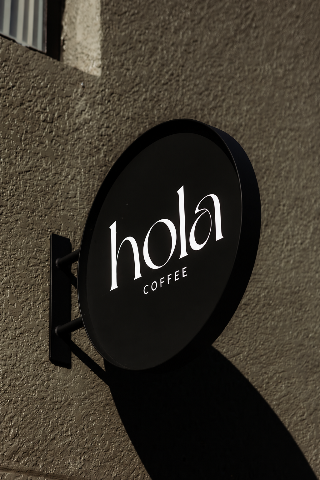 Hola Coffee’s exterior sign on Central Avenue